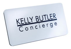 A square and silver Engraved Name Badge with this leyend: "Kelly Butler"